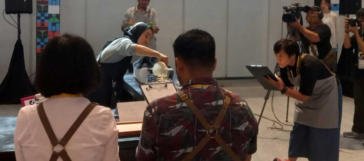 Young Riau barista competing at the Indonesian Barista Championship Young Riau barista competing at the Indonesian Barista Championship